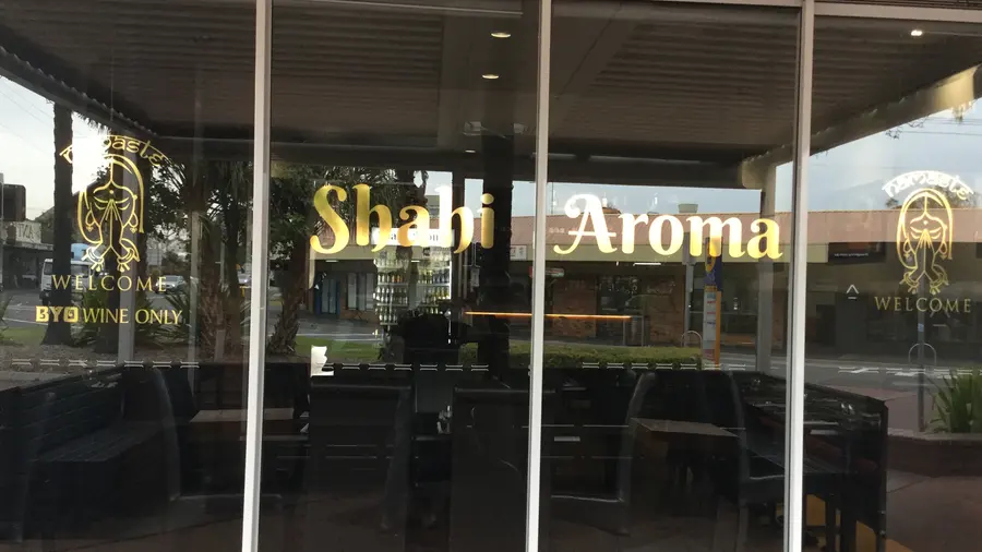 The Shahi Aroma shopfront windows with the gold Shahi Aroma lettering
